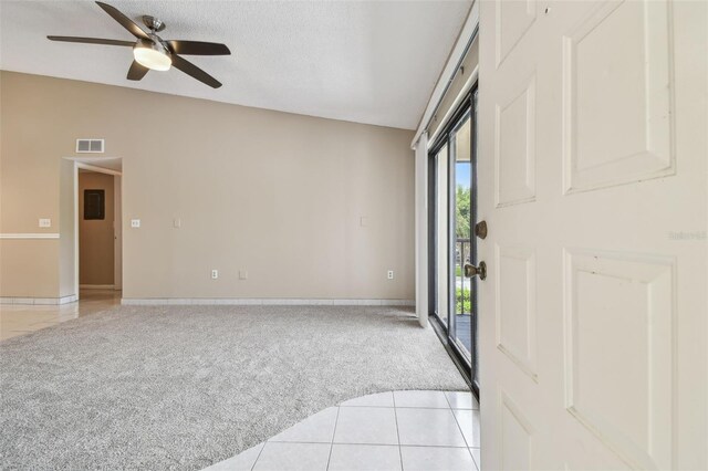 3389 Crystal Ct E J, Unit J, Palm Harbor, FL 34685 - foyer entrance featuring light colored carpet, a ceiling fan, baseboards, and light tile patterned floors