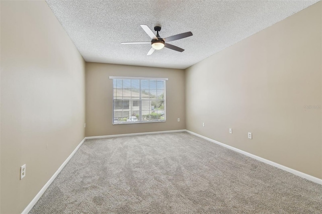 3389 Crystal Ct E J, Unit J, Palm Harbor, FL 34685 - carpeted spare room with a textured ceiling, ceiling fan, and baseboards