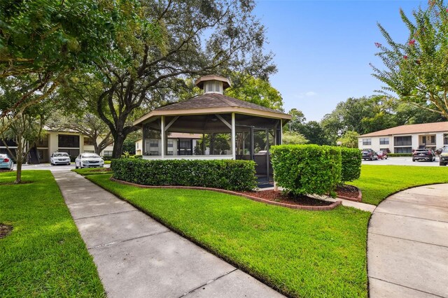 3389 Crystal Ct E J, Unit J, Palm Harbor, FL 34685 - view of front facade with a front lawn