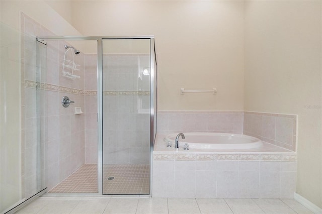 27427 Mistflower Dr, Wesley Chapel, FL 33544 - bathroom featuring tile patterned flooring, a stall shower, and a bath