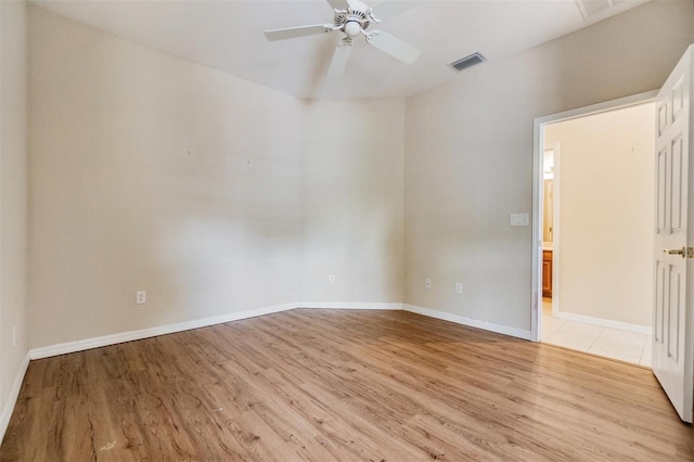 27427 Mistflower Dr, Wesley Chapel, FL 33544 - empty room with light wood-style floors, a ceiling fan, and baseboards