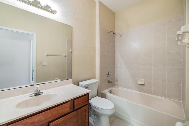 27427 Mistflower Dr, Wesley Chapel, FL 33544 - full bathroom with toilet, vanity, shower / tub combination, and tile patterned flooring