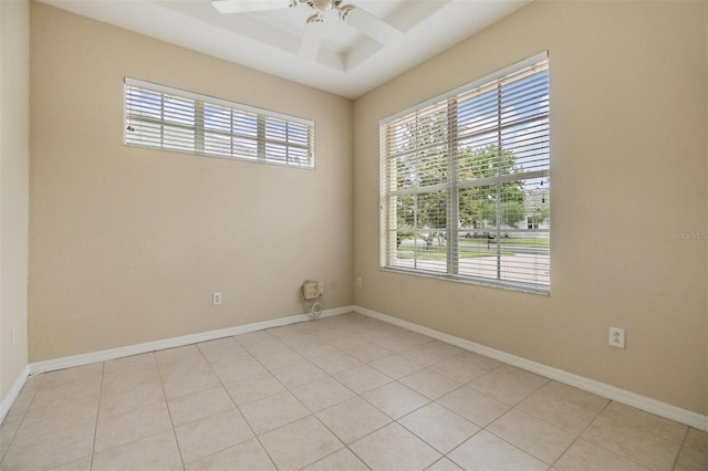 27427 Mistflower Dr, Wesley Chapel, FL 33544 - unfurnished room featuring healthy amount of natural light, a ceiling fan, light tile patterned floors, and baseboards