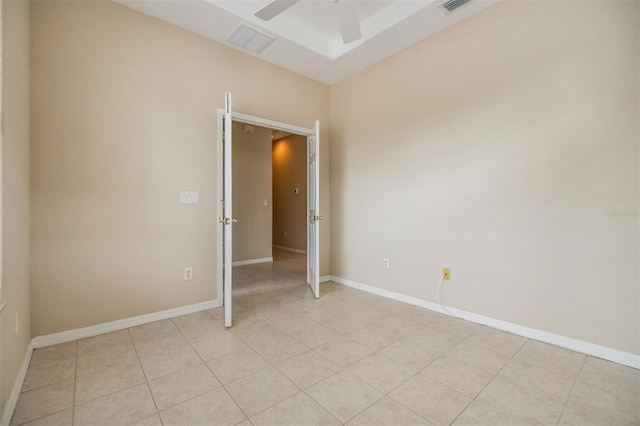 27427 Mistflower Dr, Wesley Chapel, FL 33544 - unfurnished room featuring light tile patterned floors, ceiling fan, and baseboards