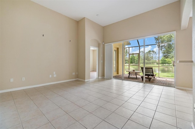27427 Mistflower Dr, Wesley Chapel, FL 33544 - spare room with light tile patterned floors and baseboards