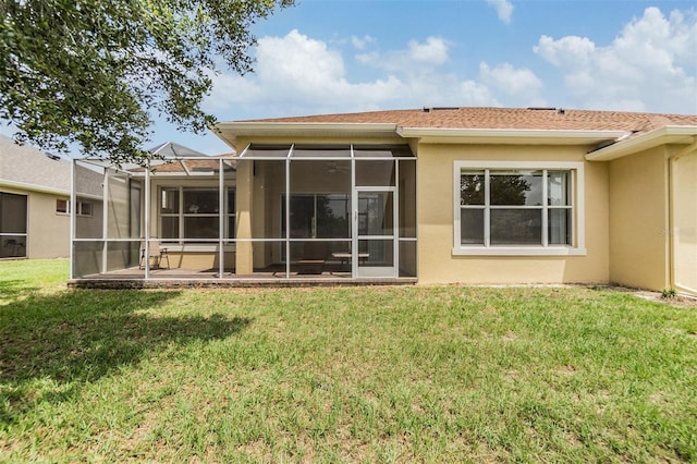 27427 Mistflower Dr, Wesley Chapel, FL 33544 - back of property featuring stucco siding and a lawn