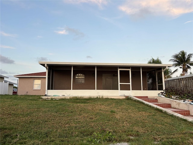 6820 26th St W, Bradenton, FL 34207 - rear view of house featuring a sunroom
