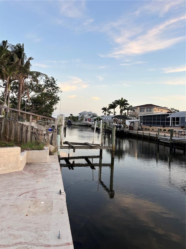 6820 26th St W, Bradenton, FL 34207 - dock featuring boat lift and a water view
