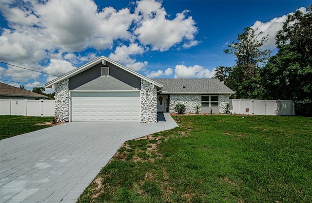 7547 Landmark Dr, Spring Hill, FL 34606 - view of front of house with an attached garage and decorative driveway