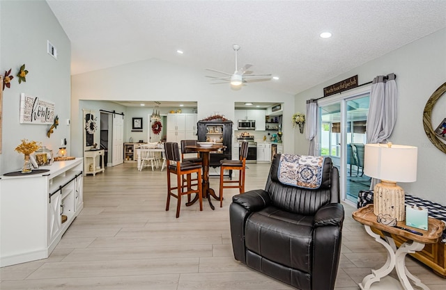 7547 Landmark Dr, Spring Hill, FL 34606 - living area featuring lofted ceiling, a ceiling fan, light wood-style floors, and recessed lighting