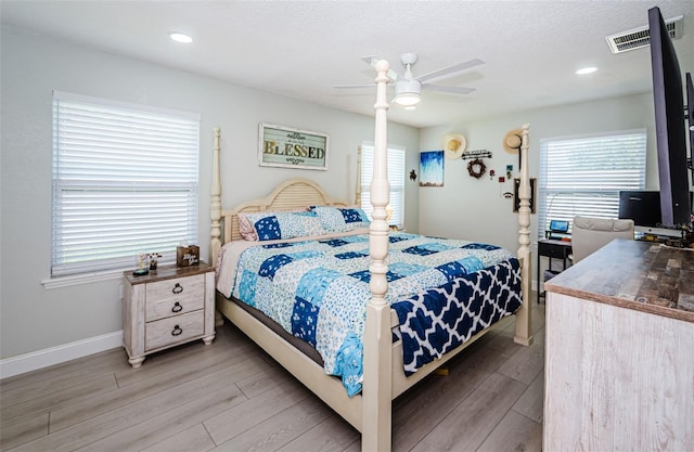 7547 Landmark Dr, Spring Hill, FL 34606 - bedroom featuring light wood finished floors and ceiling fan