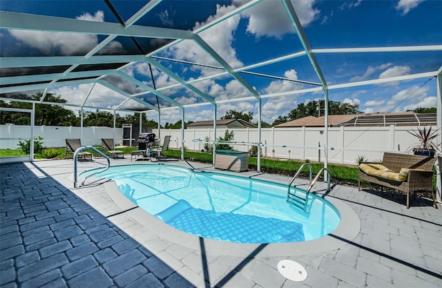 7547 Landmark Dr, Spring Hill, FL 34606 - view of pool featuring a fenced backyard, a patio, a lanai, and area for grilling