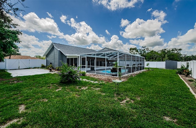 7547 Landmark Dr, Spring Hill, FL 34606 - back of house featuring a fenced backyard, a patio, an outdoor pool, a gate, and glass enclosure