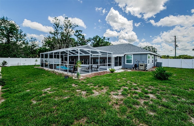 7547 Landmark Dr, Spring Hill, FL 34606 - rear view of house featuring a fenced backyard, a patio, a lanai, and roof with shingles