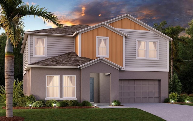1217 Tidal St, Haines City, FL 33844 - view of front of property with an attached garage, driveway, stucco siding, a front yard, and board and batten siding