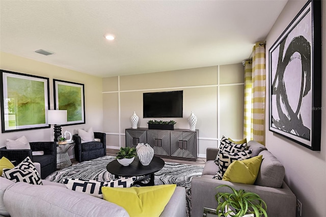 1217 Tidal St, Haines City, FL 33844 - living area featuring wood finished floors, recessed lighting, and baseboards
