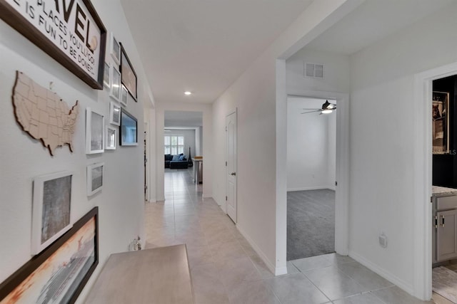 3628 Diving Dove Ln, Bartow, FL 33830 - corridor featuring light tile patterned flooring, recessed lighting, baseboards, and light colored carpet