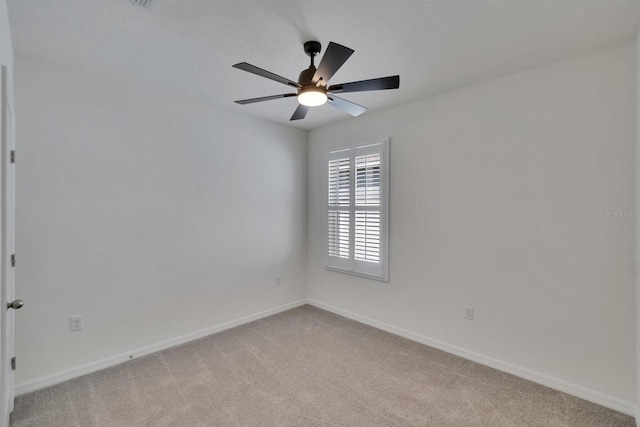 3628 Diving Dove Ln, Bartow, FL 33830 - empty room featuring light carpet, a ceiling fan, and baseboards