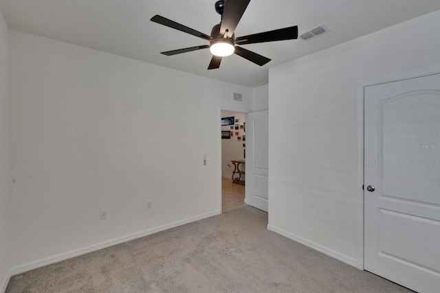 3628 Diving Dove Ln, Bartow, FL 33830 - unfurnished bedroom with light carpet, baseboards, and a ceiling fan