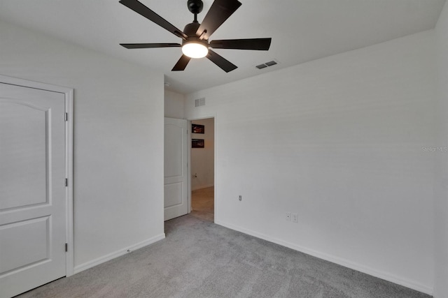 3628 Diving Dove Ln, Bartow, FL 33830 - unfurnished bedroom with light colored carpet, baseboards, and a ceiling fan