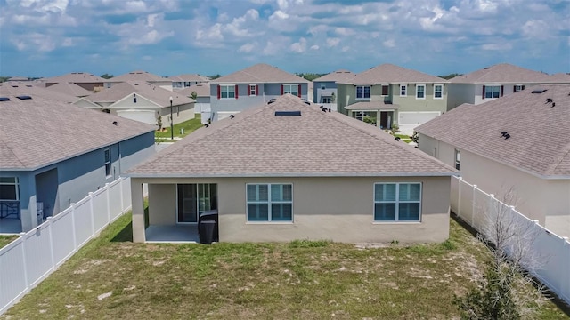 3628 Diving Dove Ln, Bartow, FL 33830 - back of property with a shingled roof, a residential view, stucco siding, and a patio