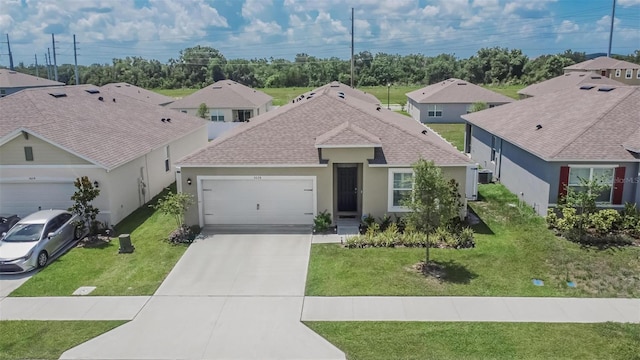 3628 Diving Dove Ln, Bartow, FL 33830 - single story home with an attached garage, a shingled roof, driveway, stucco siding, and a front yard