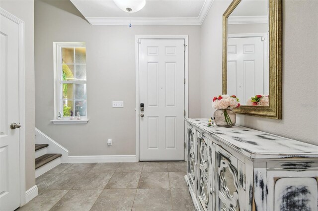 10512 Scenic Hollow Dr, Riverview, FL 33578 - foyer entrance featuring crown molding, baseboards, and stairway