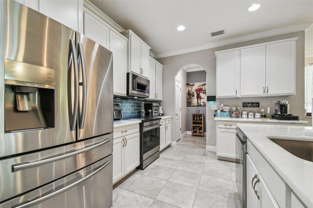 10512 Scenic Hollow Dr, Riverview, FL 33578 - kitchen featuring stainless steel appliances, light countertops, ornamental molding, recessed lighting, and tasteful backsplash