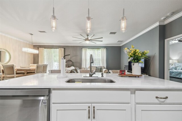 10512 Scenic Hollow Dr, Riverview, FL 33578 - kitchen featuring stainless steel dishwasher, a sink, open floor plan, light countertops, and white cabinetry