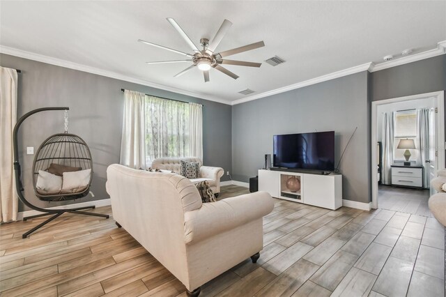 10512 Scenic Hollow Dr, Riverview, FL 33578 - living room with a ceiling fan, light wood-type flooring, ornamental molding, and baseboards