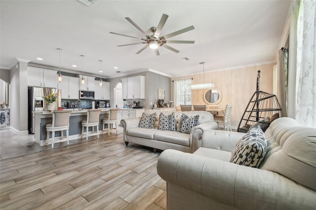 10512 Scenic Hollow Dr, Riverview, FL 33578 - living area with a ceiling fan, ornamental molding, light wood-type flooring, recessed lighting, and baseboards