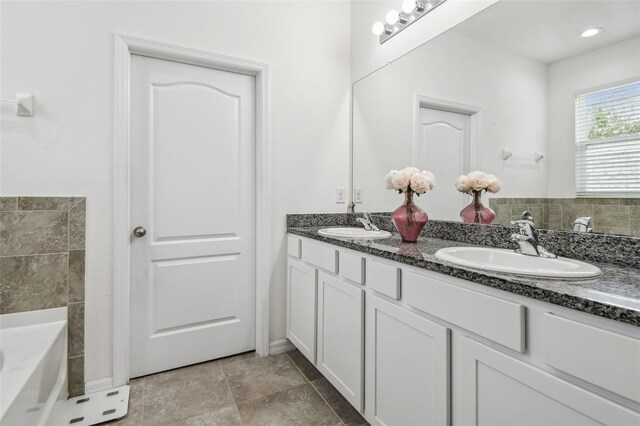 10512 Scenic Hollow Dr, Riverview, FL 33578 - bathroom featuring double vanity and a garden tub
