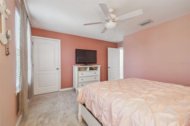 10512 Scenic Hollow Dr, Riverview, FL 33578 - bedroom with light colored carpet, baseboards, and ceiling fan