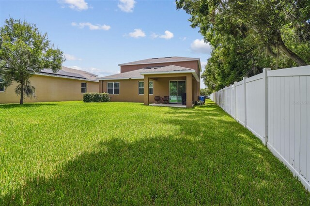 10512 Scenic Hollow Dr, Riverview, FL 33578 - rear view of house featuring stucco siding and a patio area