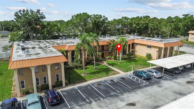 4500 E Bay Dr Unit 106, Clearwater, FL 33764 - view of property with uncovered parking