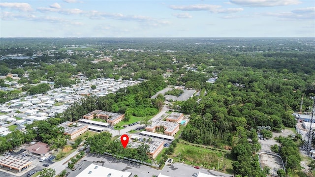 4500 E Bay Dr Unit 106, Clearwater, FL 33764 - aerial view of property and surrounding area featuring a heavily wooded area