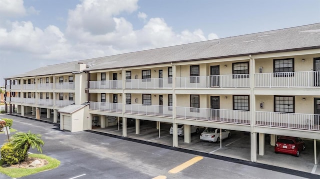 340 Causeway Blvd Unit 105, Dunedin, FL 34698 - view of property with covered parking