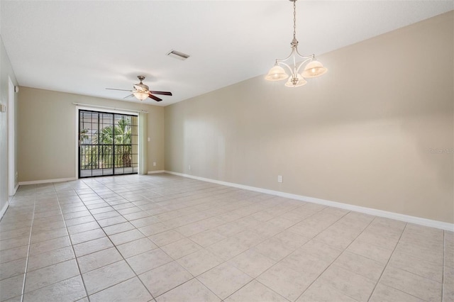 340 Causeway Blvd Unit 105, Dunedin, FL 34698 - empty room featuring ceiling fan, light tile patterned floors, baseboards, and a chandelier