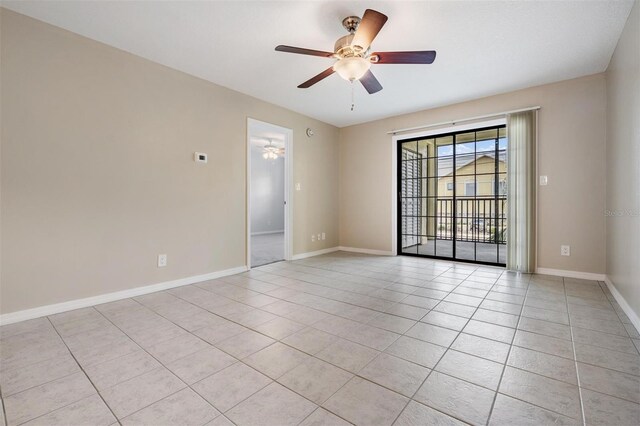 340 Causeway Blvd Unit 105, Dunedin, FL 34698 - unfurnished room with a ceiling fan, light tile patterned floors, and baseboards