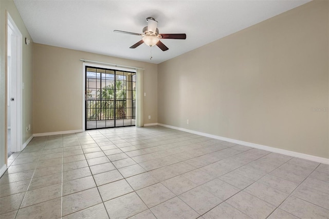 340 Causeway Blvd Unit 105, Dunedin, FL 34698 - unfurnished room featuring ceiling fan, baseboards, and light tile patterned flooring