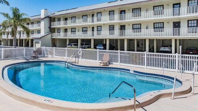 340 Causeway Blvd Unit 105, Dunedin, FL 34698 - community pool with a patio