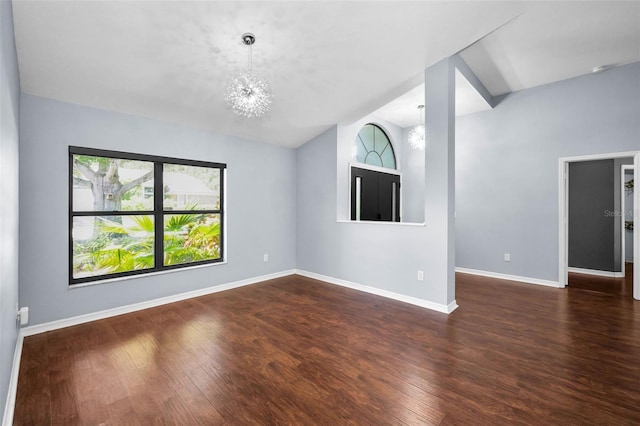 2459 Parkstream Ave, Clearwater, FL 33759 - unfurnished room featuring wood finished floors, a chandelier, and lofted ceiling