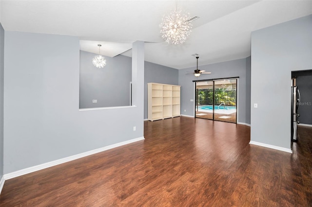 2459 Parkstream Ave, Clearwater, FL 33759 - spare room featuring a chandelier, wood finished floors, a ceiling fan, and vaulted ceiling