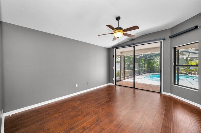 2459 Parkstream Ave, Clearwater, FL 33759 - unfurnished room featuring vaulted ceiling, ceiling fan, and wood finished floors
