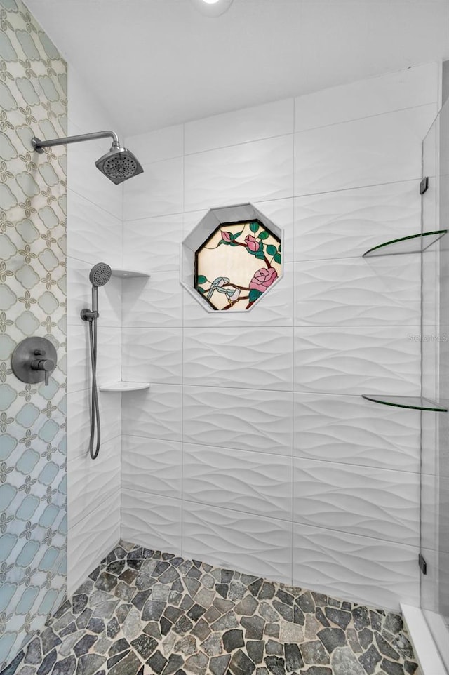 2459 Parkstream Ave, Clearwater, FL 33759 - bathroom with a tile shower and stone finish floors