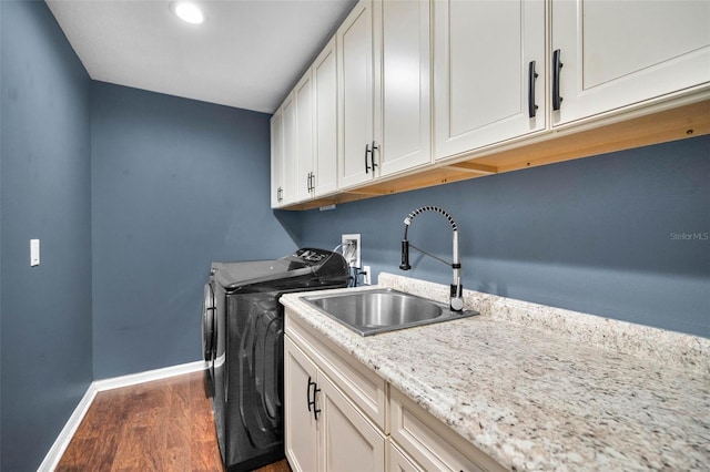 2459 Parkstream Ave, Clearwater, FL 33759 - washroom featuring washer hookup, cabinet space, and wood finished floors