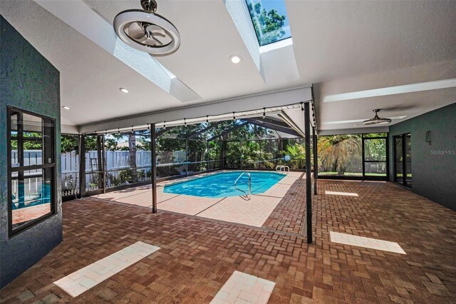 2459 Parkstream Ave, Clearwater, FL 33759 - view of swimming pool with a skylight, a pool, and a ceiling fan