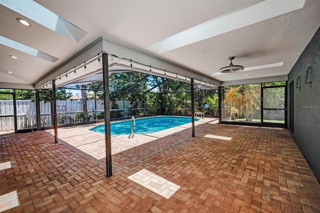 2459 Parkstream Ave, Clearwater, FL 33759 - view of swimming pool featuring a lanai, a patio area, and a ceiling fan