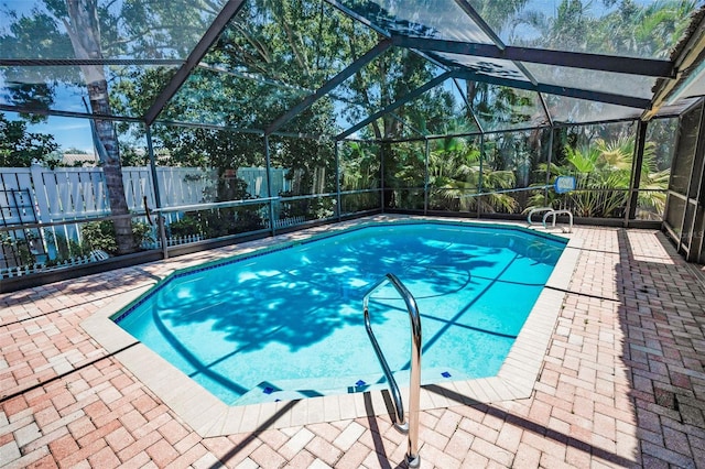 2459 Parkstream Ave, Clearwater, FL 33759 - view of swimming pool featuring a patio area, a lanai, and a fenced backyard