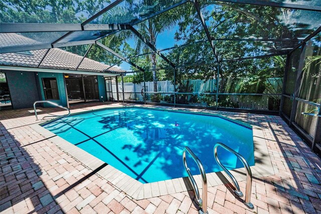2459 Parkstream Ave, Clearwater, FL 33759 - view of pool with a fenced backyard, a patio area, and glass enclosure
